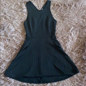 Black textured mini dress with pockets